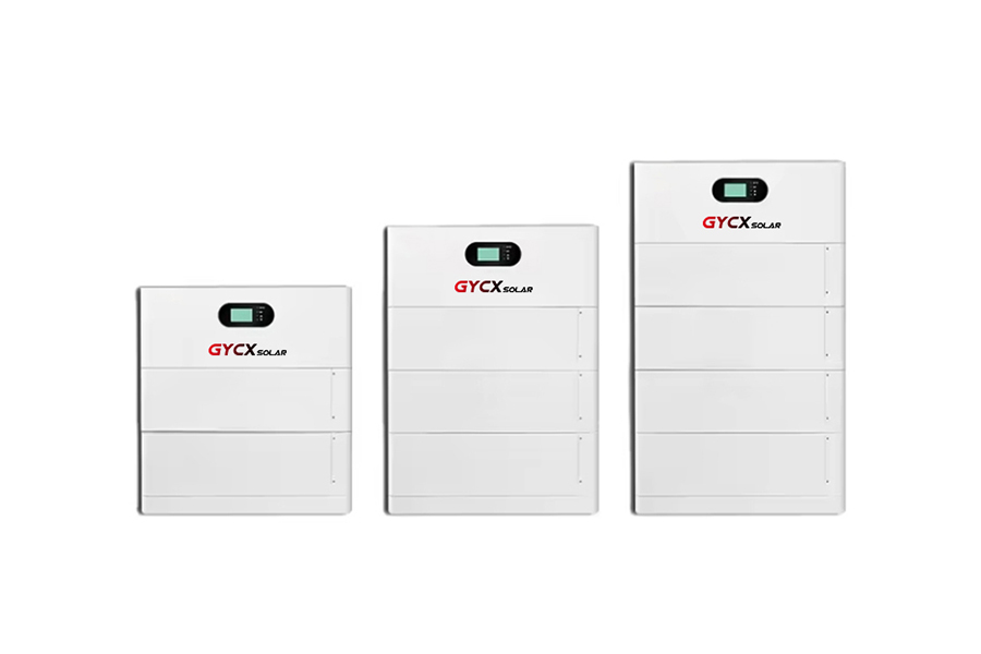 Image showing a neat stack of modern lithium battery modules, possibly with some subtle branding or in a home/garage setting next to a solar inverter.