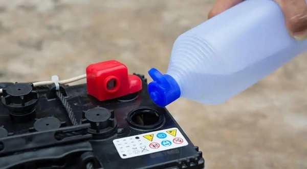 Flooded lead acid battery with maintenance caps open